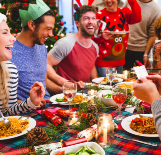A group of people enjoying christmas lunch