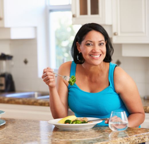 Image of mature adult eating dinner