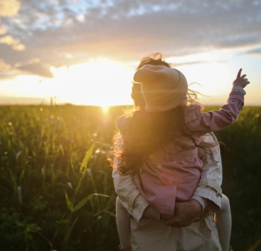 Mother and daghter watching the sunset