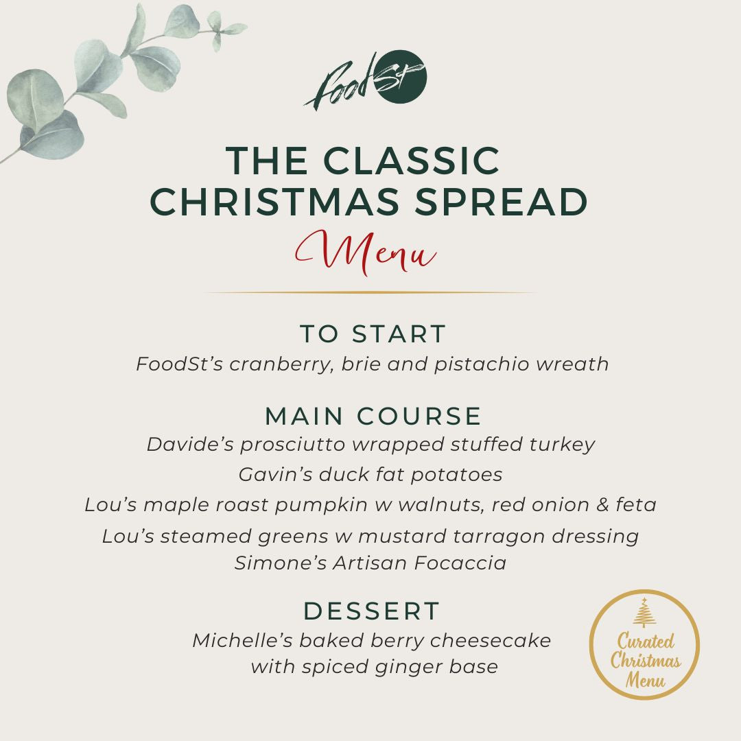 Sliced turkey on a wooden board with text about a traditional Christmas menu.