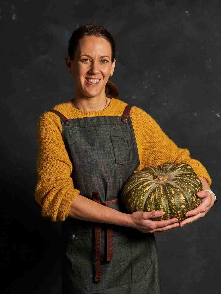 Photo of Michelle holding a pumpkin