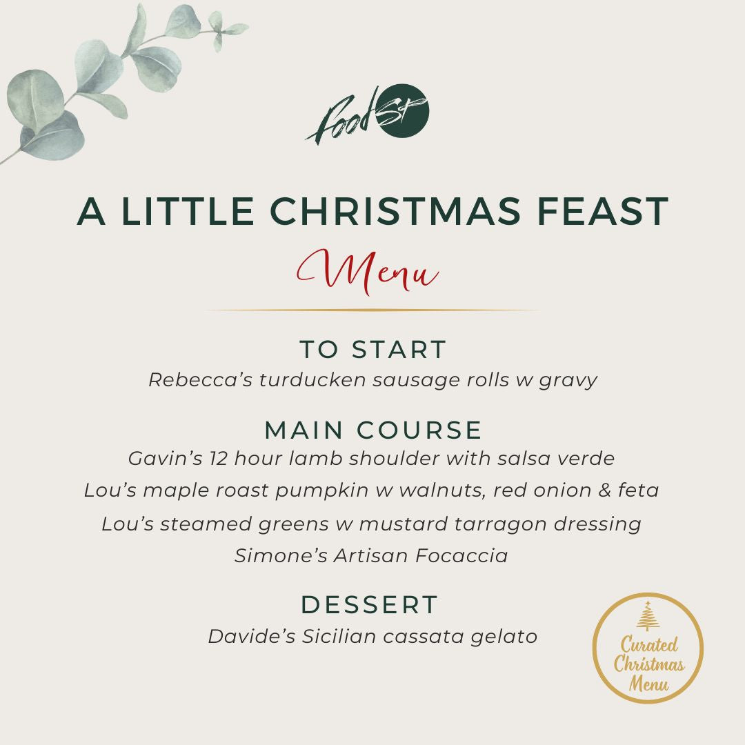 Family enjoying a Christmas meal with festive hats, text overlay about a Christmas feast menu.