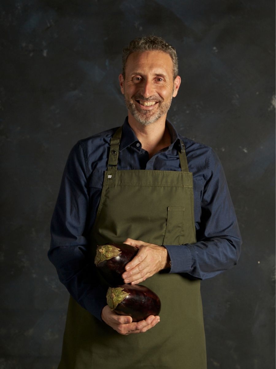 Portrait of Maurice holding eggplants