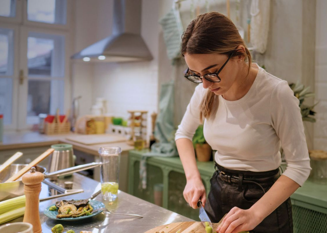 Woman meal prepping in her rustic kitchen at home, 