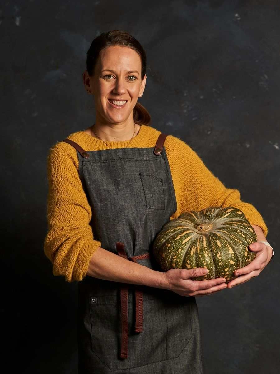 Photo of Michelle holding a pumpkin