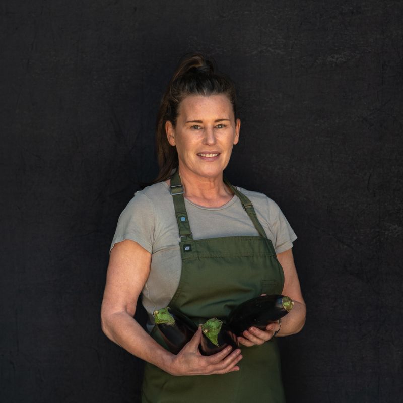 Portrait of Denise holding eggplant 