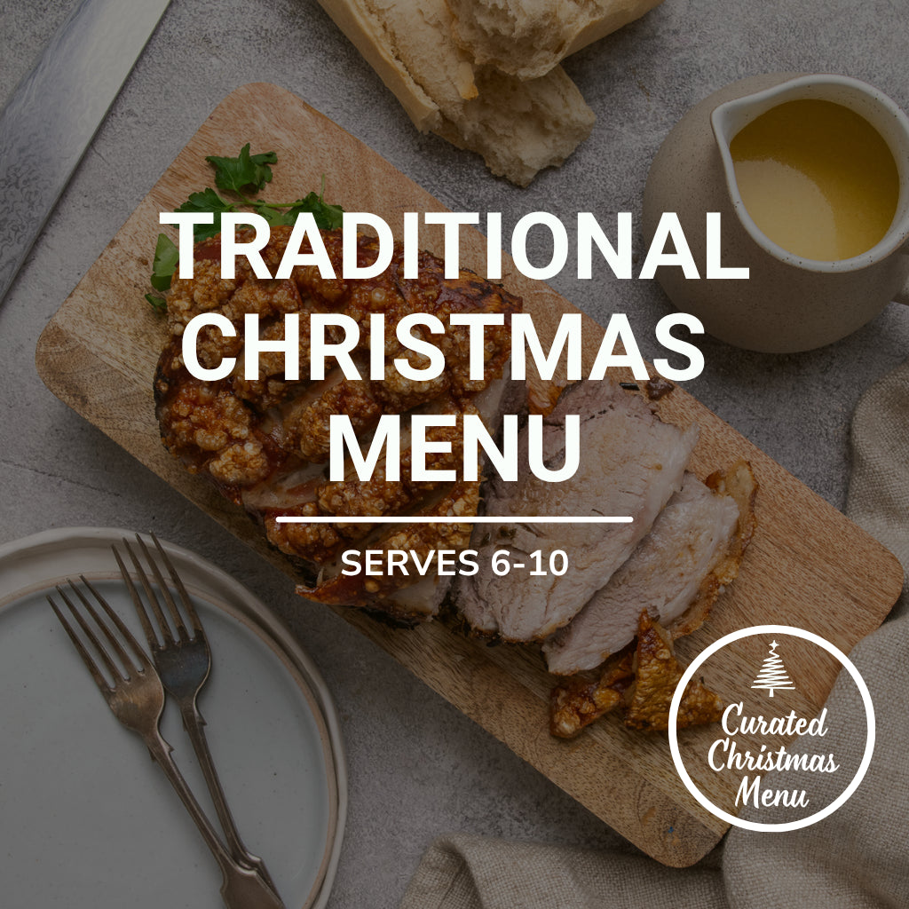 Traditional Christmas menu with sliced turkey on a wooden board, served for 6-10 people, with a 'Curated Christmas Menu' logo.