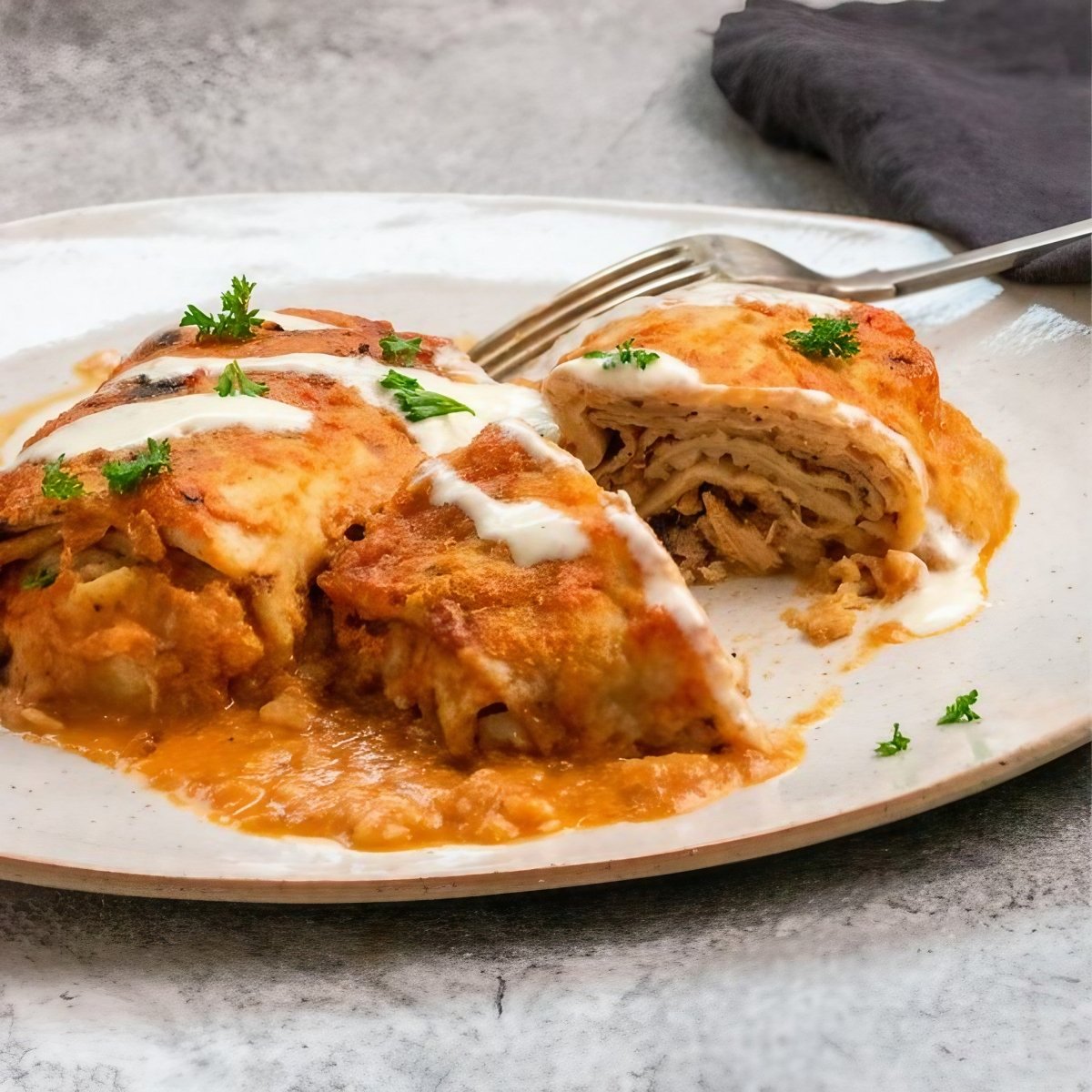 Hortobágyi garnished with herbs on a white plate