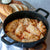 A serving of Amalia's Stuffed Cabbage Rolls topped with sour cream