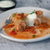 A serving of Amalia's Stuffed Cabbage Rolls topped with sour cream