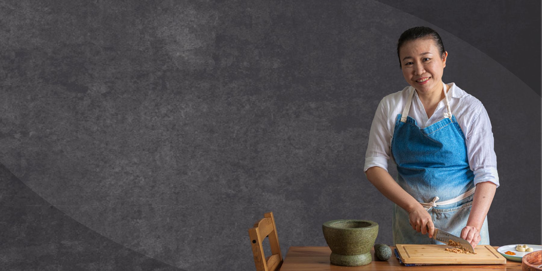 Image of Iris, Home Cook chopping ginger with grey background