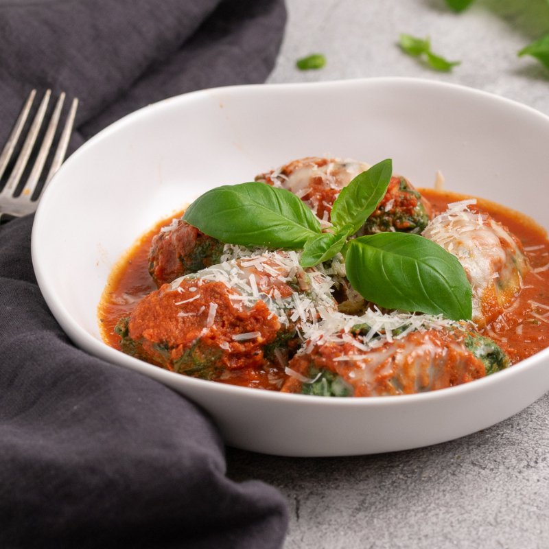 Davide&#39;s Italian Gnudi in a white bowl, close up