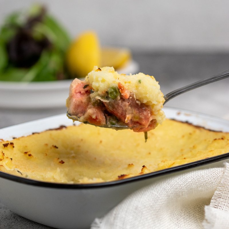 Image of a spoon serving a piece of Gavin&#39;s Salmon &amp; Leek Pie showing pink salmon pieces