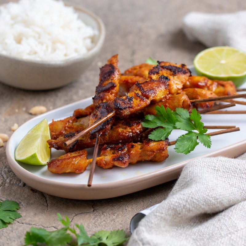 Image of Chicken Satay Sticks piled upon a plate