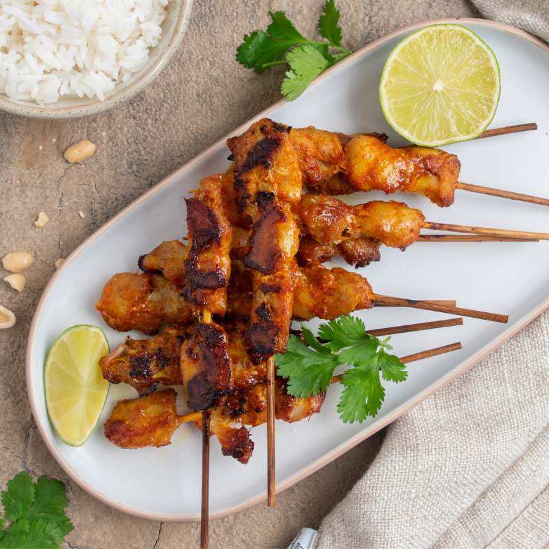 Image of Chicken Satay Sticks piled upon a plate