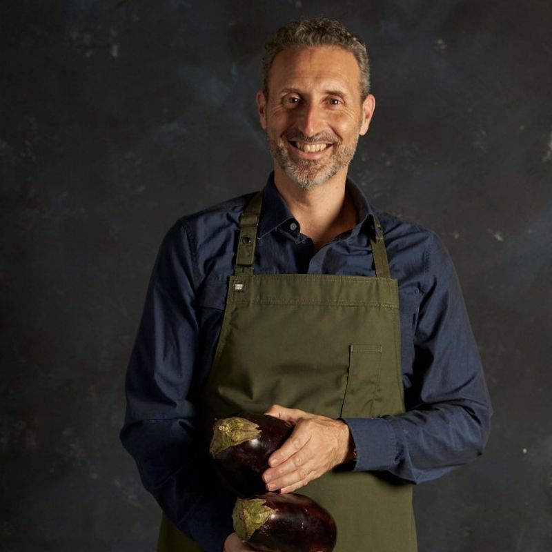 Image of Maurice holding eggplants