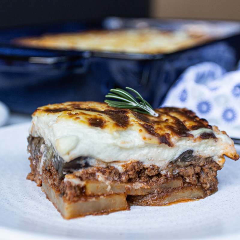 A slice of Maurice&#39;s Moussaka  on a plate - FoodSt