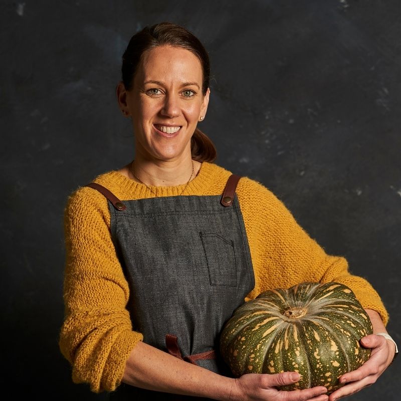 Photo of Michelle holding a pumpkin